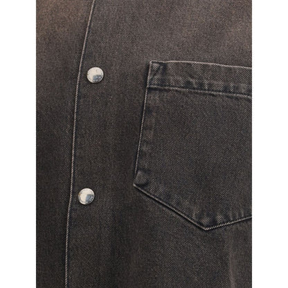 Close-up of 7FOR Black Cotton Denim Jacket showcasing front button closure and patch pocket detail for a relaxed, edgy style.