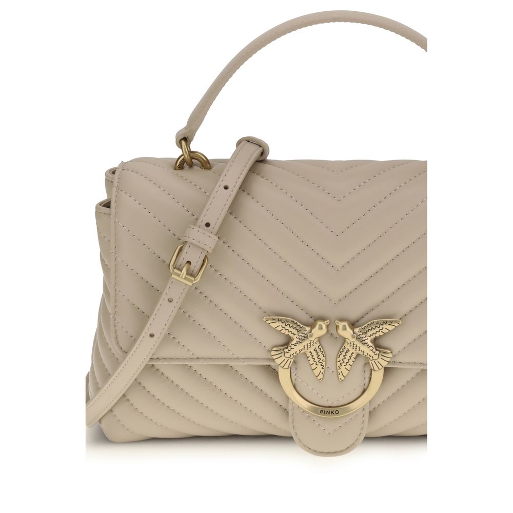 Front view with bag zipped and handles upright.