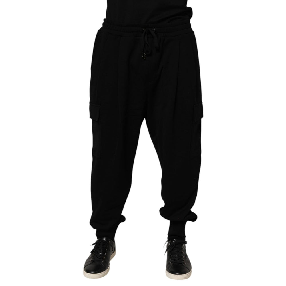 Dolce & Gabbana Black Cotton Blend Cargo Joggers Drawstring Pants with elastic waistband and side pockets, modeled. High-end streetwear style.