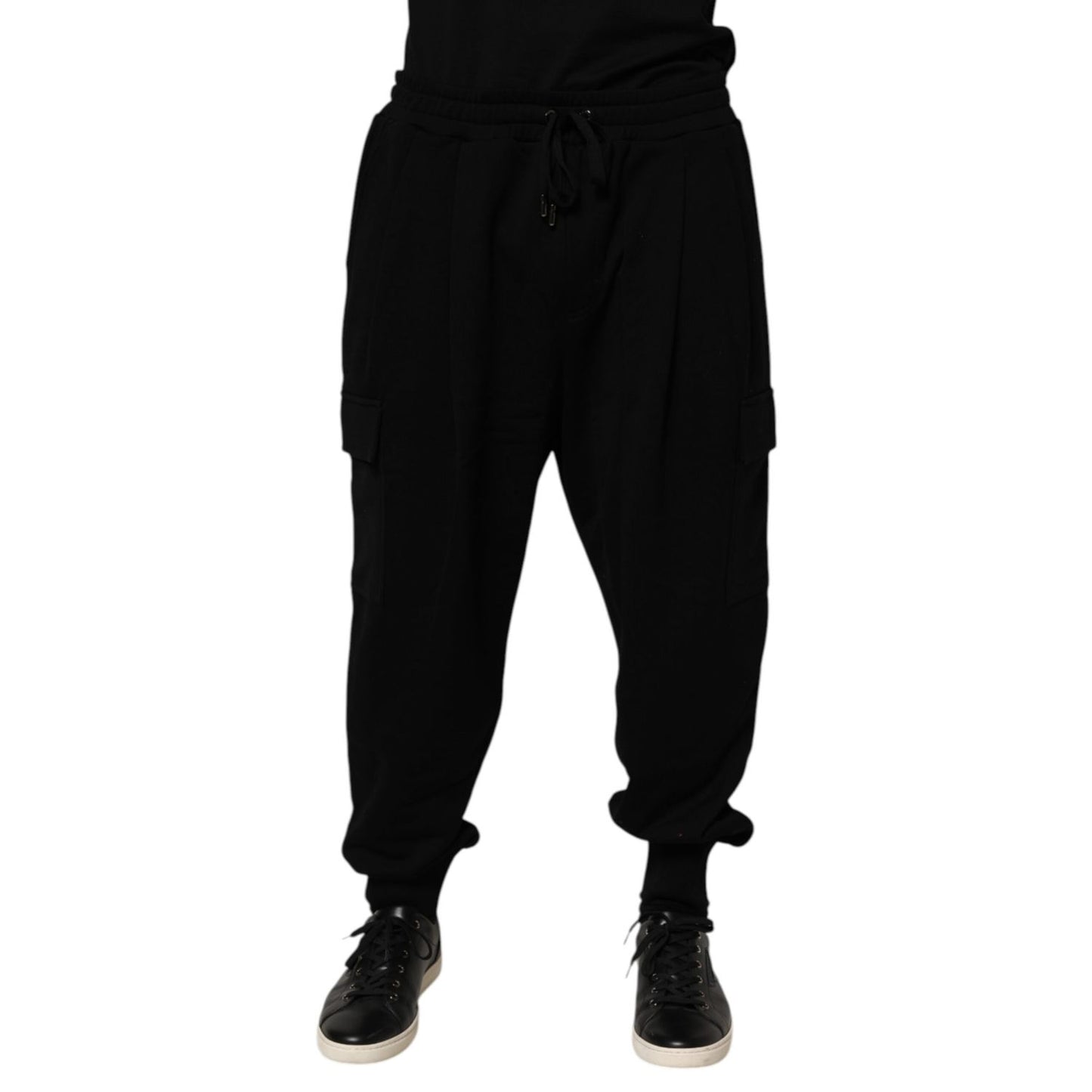 Dolce & Gabbana Black Cotton Blend Cargo Joggers Drawstring Pants with elastic waistband and side pockets, modeled. High-end streetwear style.
