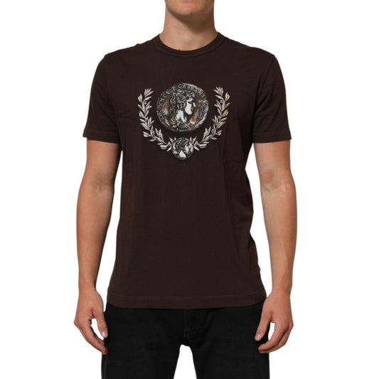 Man wearing Dolce & Gabbana Brown Coin Laurel Print Men Crew Neck T-shirt with intricate design, short sleeves, and regular fit.