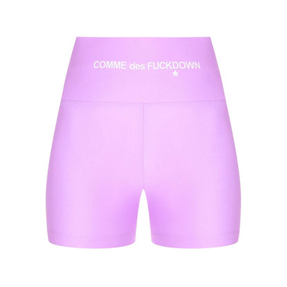 Comme Des Fuckdown Purple Polyester Short with front logo print, stretch lycra biker shorts displayed against white background.