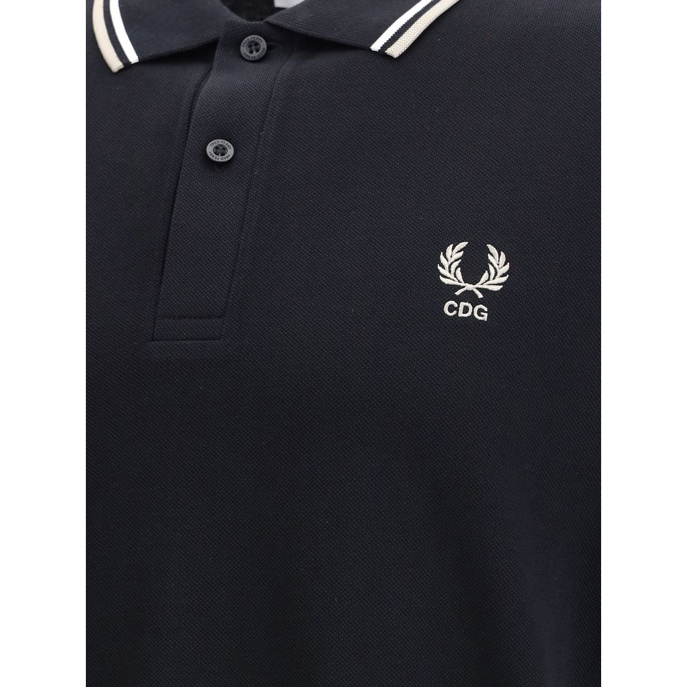 Comme Des Garçons Black Cotton Polo Shirt close-up with CDG emblem and white stripe detail on collar, featuring a bold yet classic style.