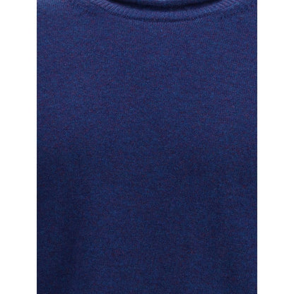 Comme Des Garçons Blue Wool Sweatshirt with ribbed knit texture and round neckline, showcasing elegant long sleeves, AW25 collection.