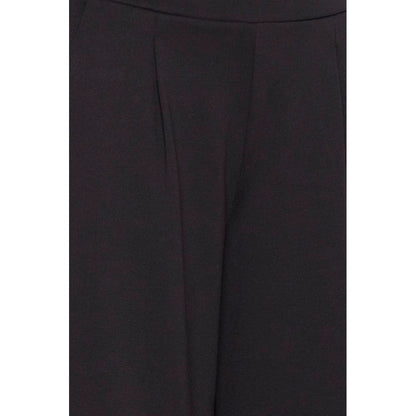 ICHI Black Recycled Polyester Flared Pants close-up showing fabric texture and pleats for modern, sustainable fashion.