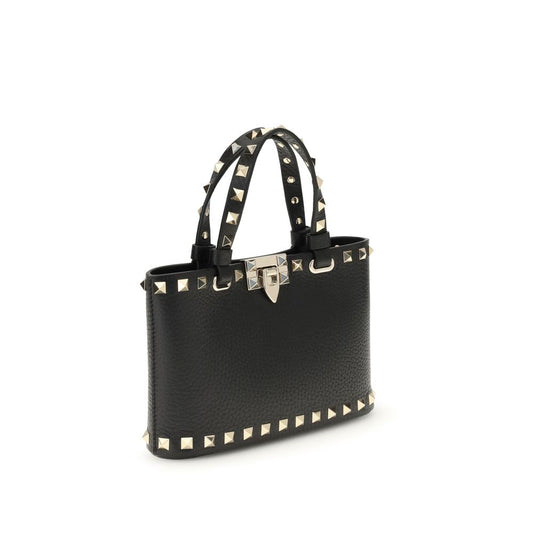 Valentino Garavani Mini Shopping Rockstud in black leather with platinum-finish studs, detachable chain, and dual carrying options.