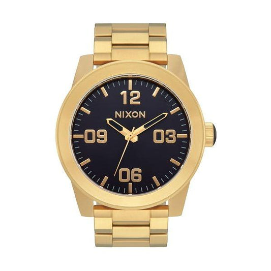 Gold Nixon Mod Corporal watch with black dial and gold hour markers.