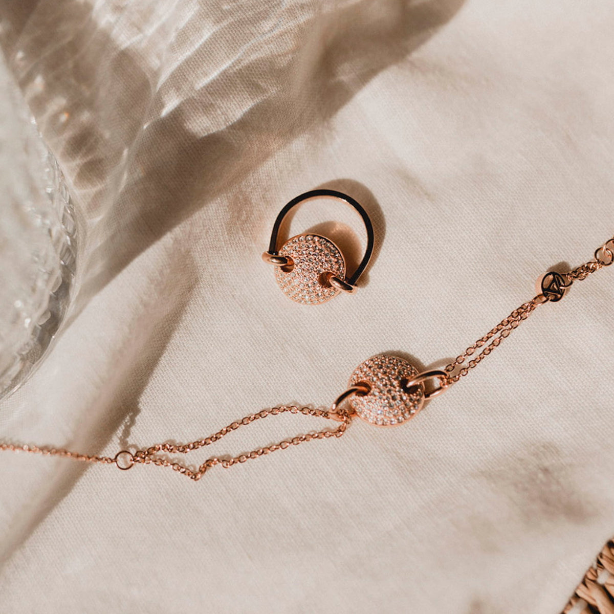 Elegant AN JEWELS JEWELRY Mod. AL.BJT01RC set displayed on white fabric background, showcasing intricate design.