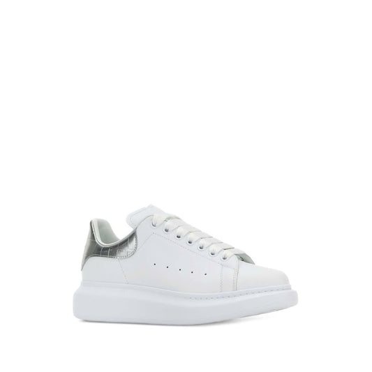 Alexander McQueen Sneakers Silver with metallic heel, crocodile embossed detailing, and oversized rubber sole.