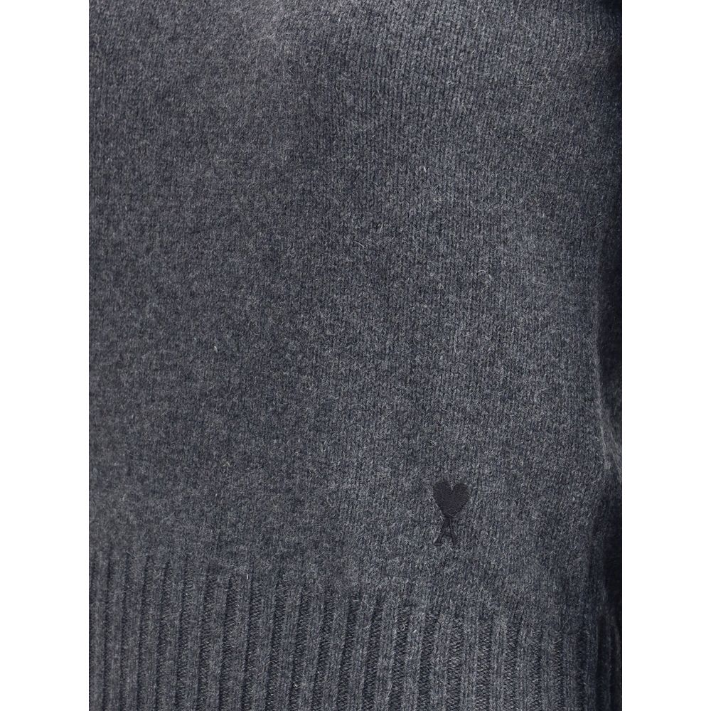 Ami Paris Gray Cashmere Cashmere Sweater with iconic Ami De Coeur logo, featuring ribbed crew neck, hem, and cuffs for timeless appeal.