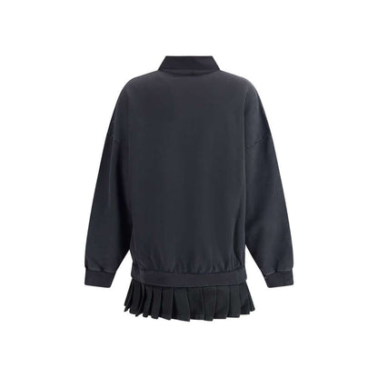 Back view of Balenciaga Black Cotton Casual Dress with pleated skirt, ribbed cuffs, and oversized silhouette for a chic casual look.