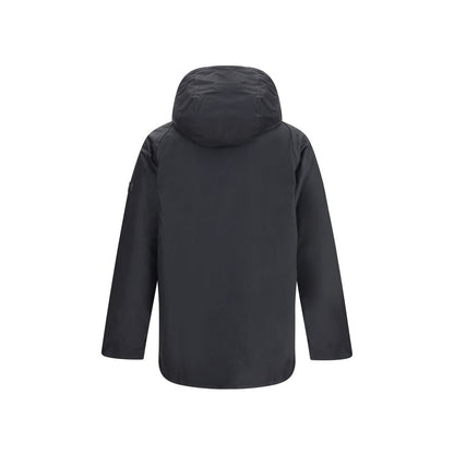 Rear view of Barbour International Black Cotton Parka with hood, showcasing padded design and logo patch. Ideal for cold weather.