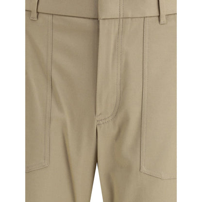 Close-up of Brioni Beige Cotton Cargo Pants with front patch pockets and zip closure.
