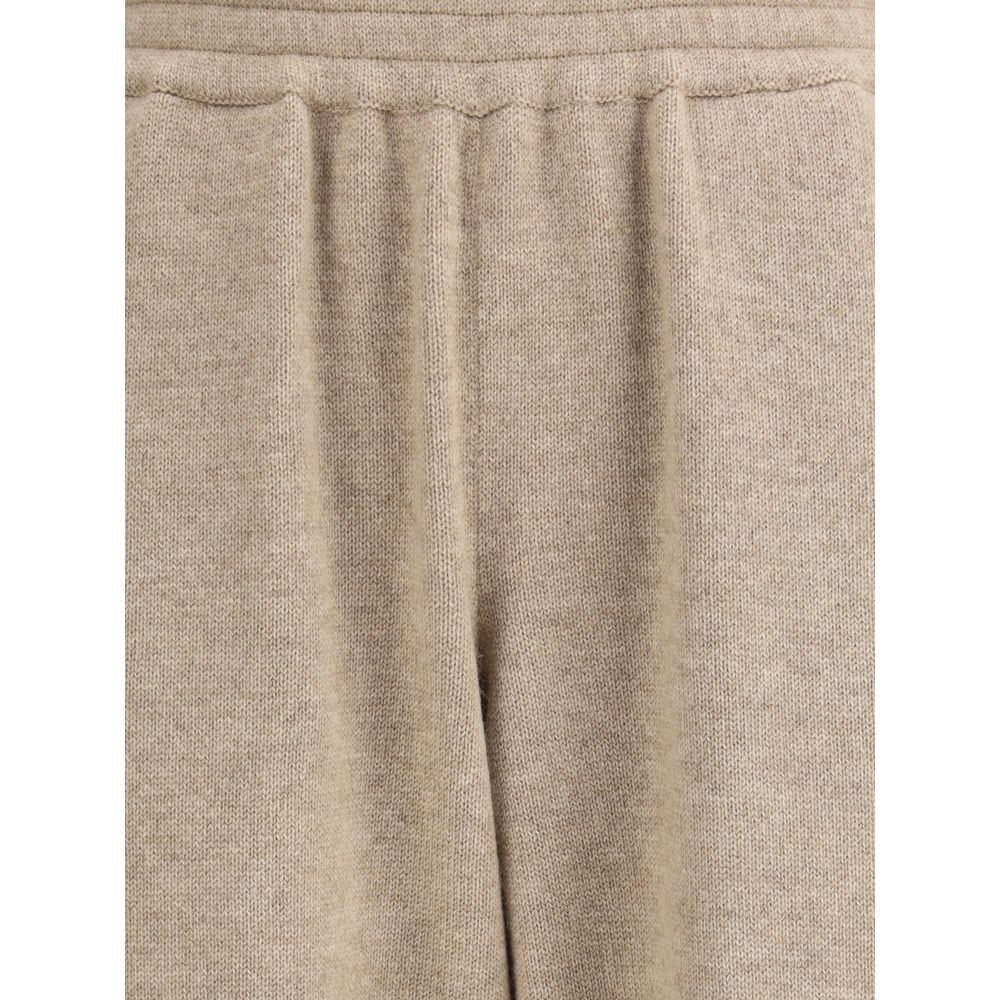 Close-up of Brunello Cucinelli Beige Cashmere Pants with elasticized waistband and soft tapering silhouette for casual wear.