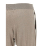 Close-up of Brunello Cucinelli Lurex-detail trousers with taupe grey color, elasticised waistband, and tapered leg design.