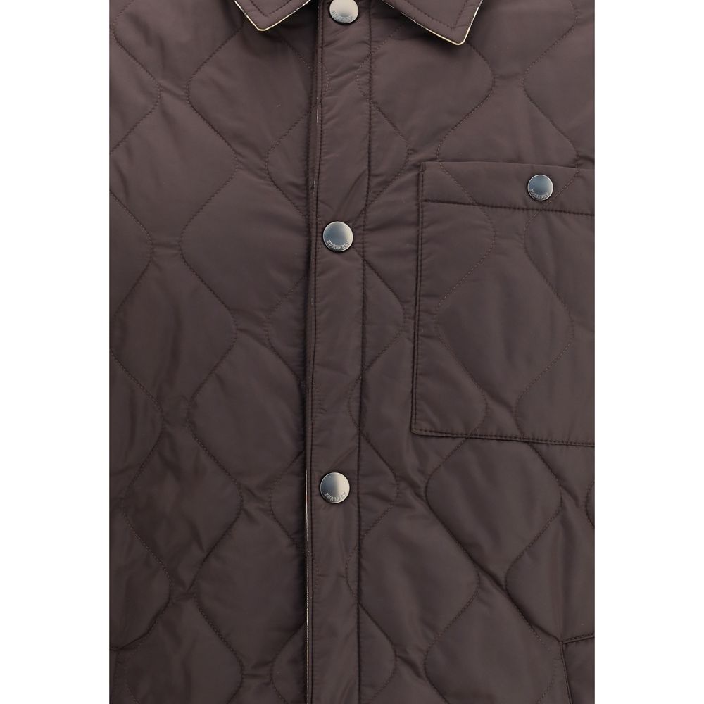 Burberry Brown Polyamide Coat featuring quilted nylon, snap button closure, and chest pocket for a stylish and functional outerwear.