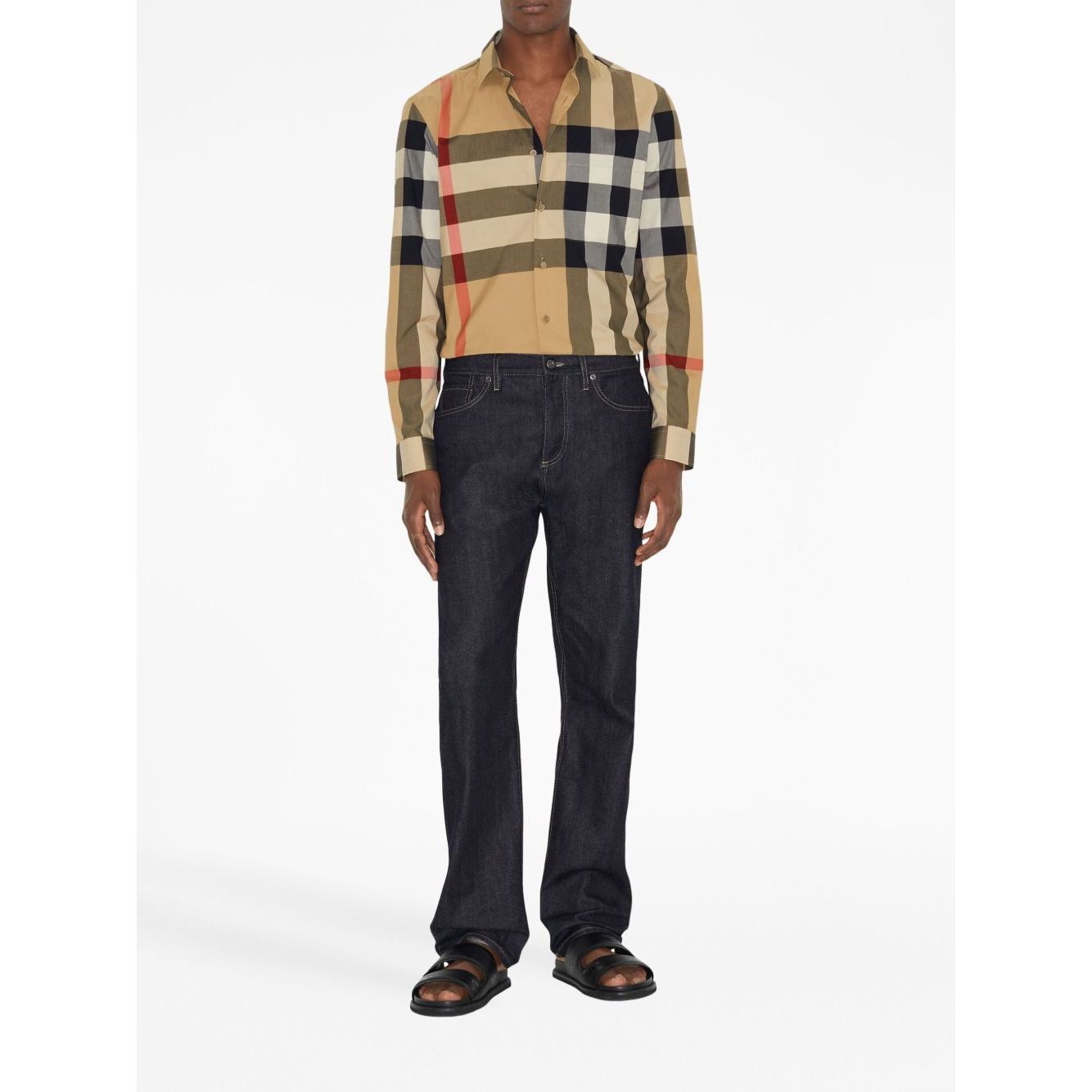 Model wearing Burberry Check cotton shirt with archive beige check print and classic collar, paired with dark jeans.