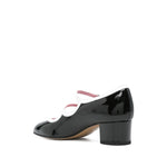 CAREL PARIS With Heel Black patent leather pumps with low block heel and double buckle fastening.
