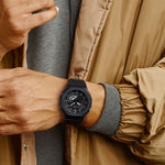 Person wearing CASIO G-SHOCK Mod. NEW OAK Black - Tough Solar. Bluetooth smartwatch, showing its elegant carbon & resin design.
