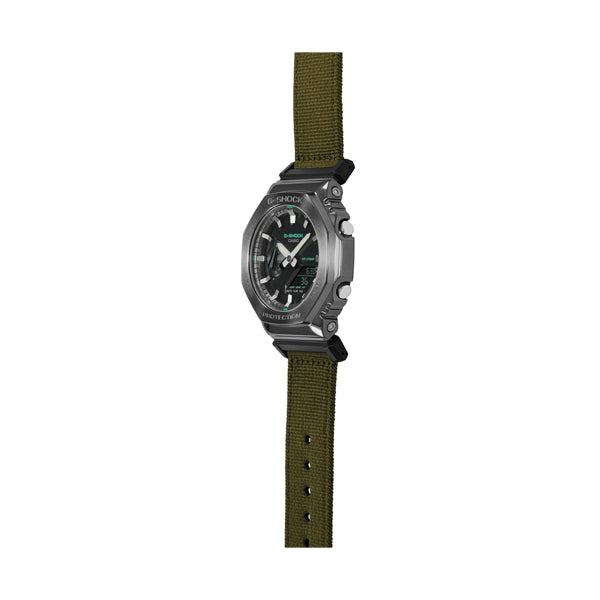 CASIO G-SHOCK Mod. OAK METAL COVERED - UTILITY SERIE KHAKI GREEN wristwatch with khaki fabric strap, featuring multifunction quartz movement.