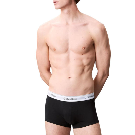 Model wearing Calvin Klein Underwear Black Cotton Boxer with logo waistband, showcasing low-rise design and comfortable fit.