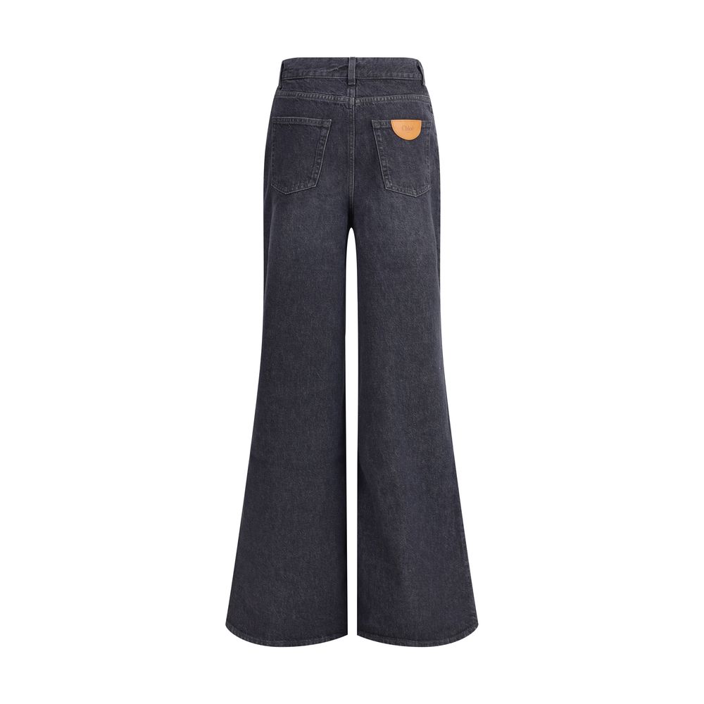 Chloé Black Cotton Flared Jeans back view showing leather logo patch and flared leg design, ideal for versatile and refined casual looks.
