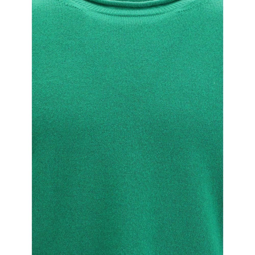 Comme Des Garçons Green Wool Sweatshirt with ribbed knit texture, round neckline, and long sleeves, ideal for elegant everyday wear.