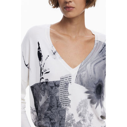 Model wearing Desigual White Viscose Women Sweater with V-neck and artistic patterns.