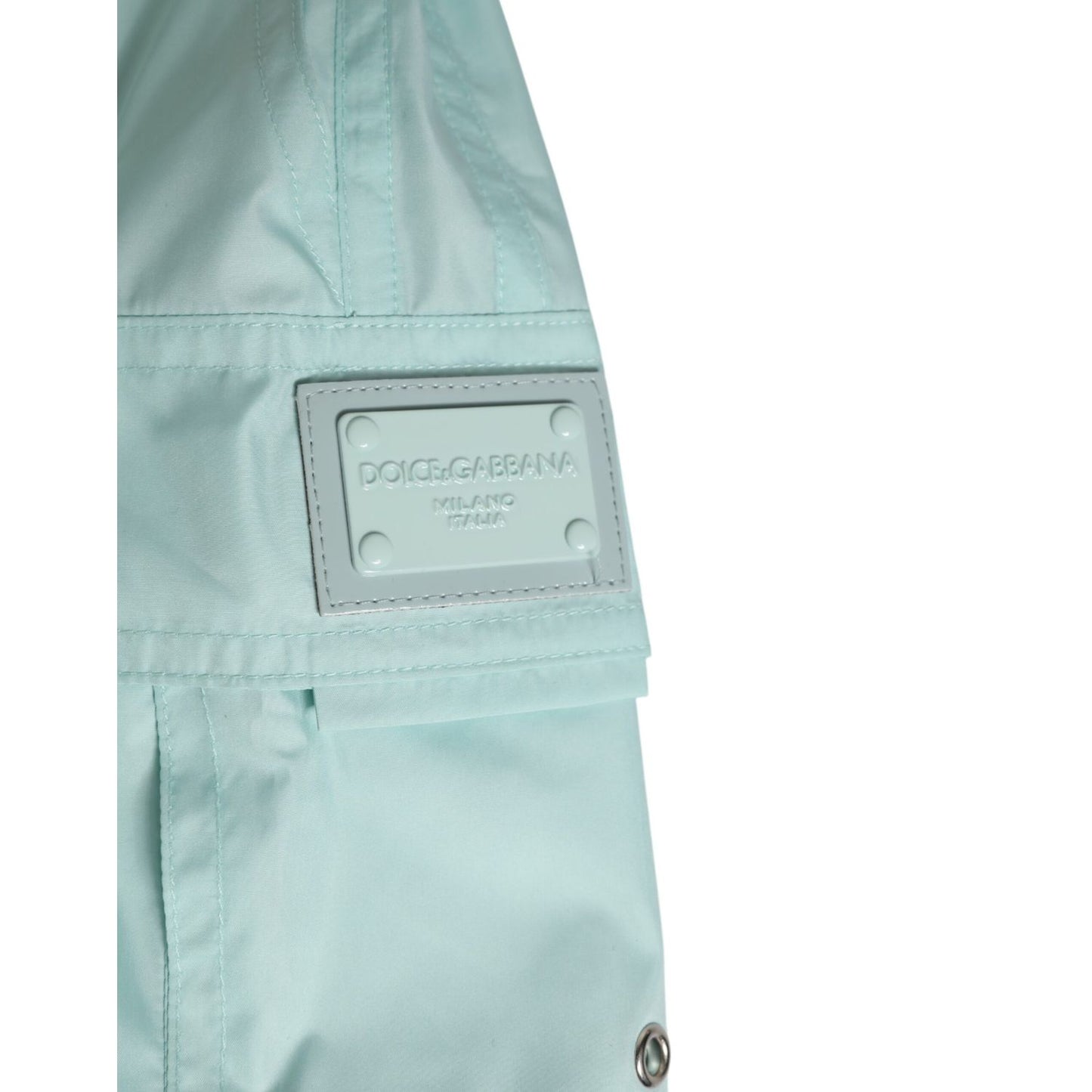 Close-up of Dolce & Gabbana Aqua Blue Polyester Beachwear Men Shorts Swimwear showing logo and fabric details.