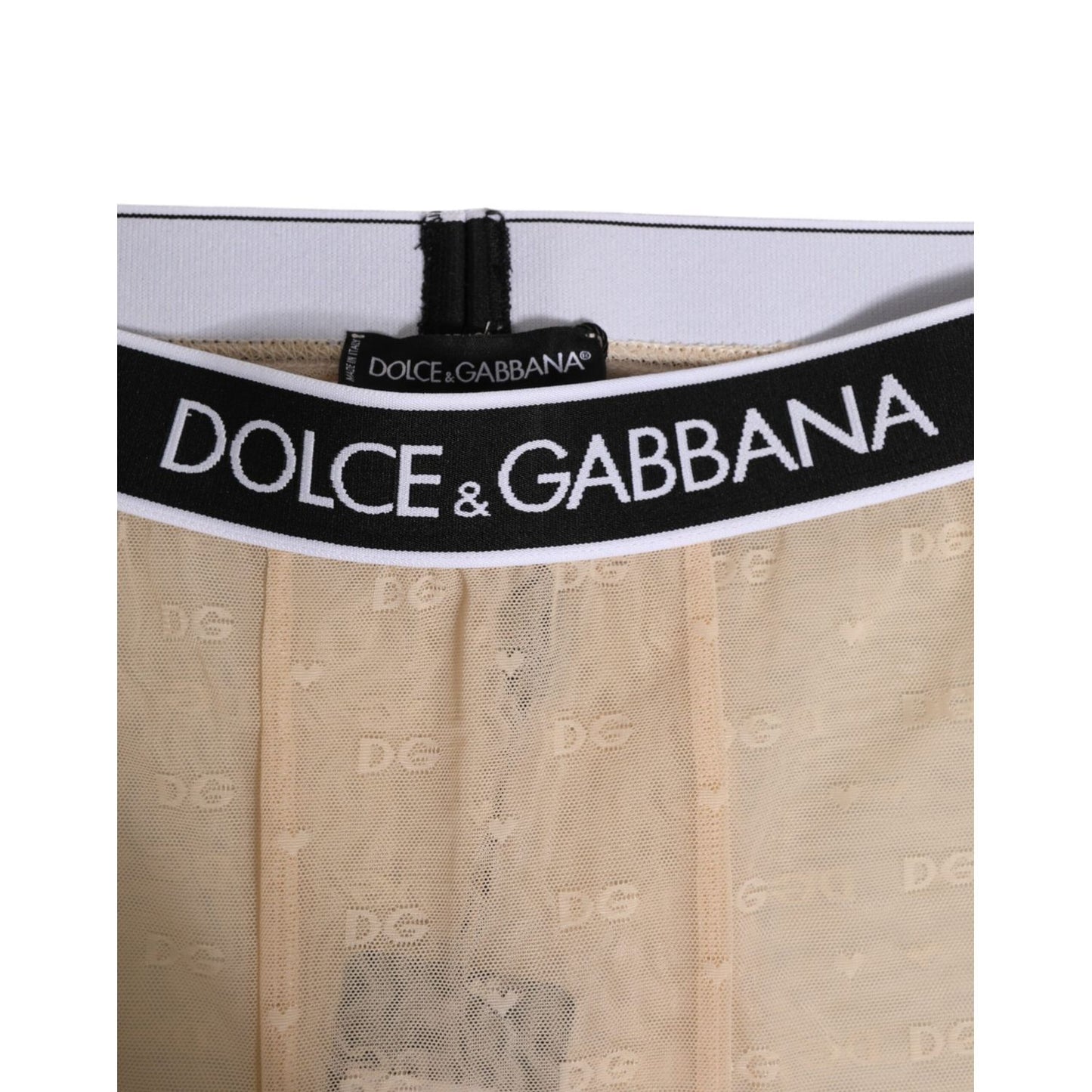 Close-up of Dolce & Gabbana Beige Nylon Logo Lace Leggings Pants Underwear with DG logo waistband in beige lace.