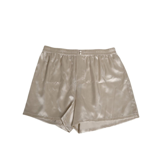 Dolce & Gabbana Beige Silk Satin Elastic Men Boxer Short Swimwear with button detail and luxury finish.
