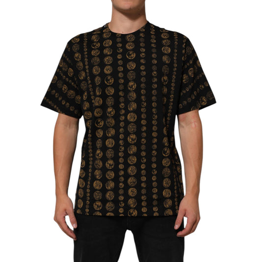 Dolce & Gabbana Black Cotton Coin Print Crew Neck T-shirt featuring short sleeves and gold coin pattern, model wearing front view, made in Italy.
