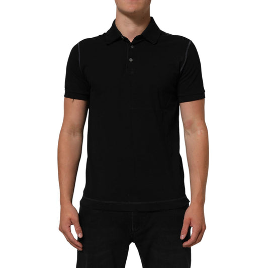Person wearing Dolce & Gabbana Black Cotton Graphic Print PoloShirt T-shirt with classic collar and button placket.
