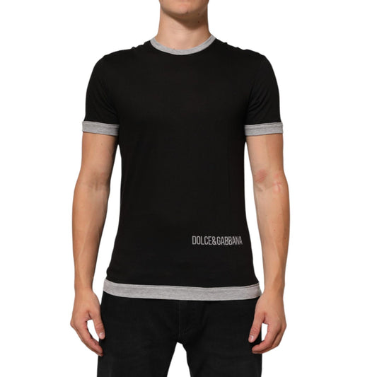 Man wearing Dolce & Gabbana Black Cotton Logo Print Men Crew Neck T-shirt with grey trim detail.