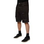 Dolce & Gabbana Black Cotton Tattered Denim Men Bermuda Short with distressed details in premium 100% cotton fabric.