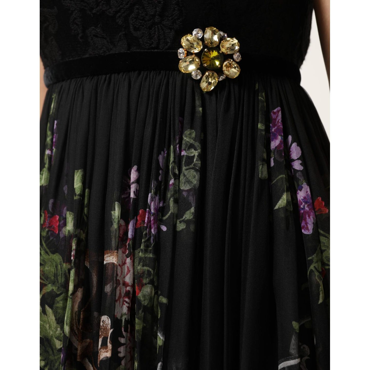 Close-up of Dolce & Gabbana Black Floral Key Print Crystal Strapless Dress with brooch detail.