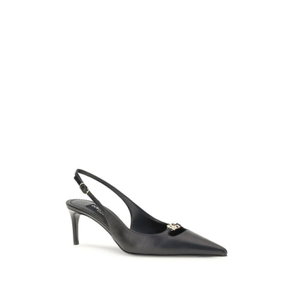 Dolce & Gabbana Black Goatskin High Heel Pumps with gold logo, tapered toe, and adjustable strap.