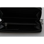 Interior view of Dolce & Gabbana Black Leather #DGFAMILY Zipper Continental Mens Wallet showing compartments and zipper detail.