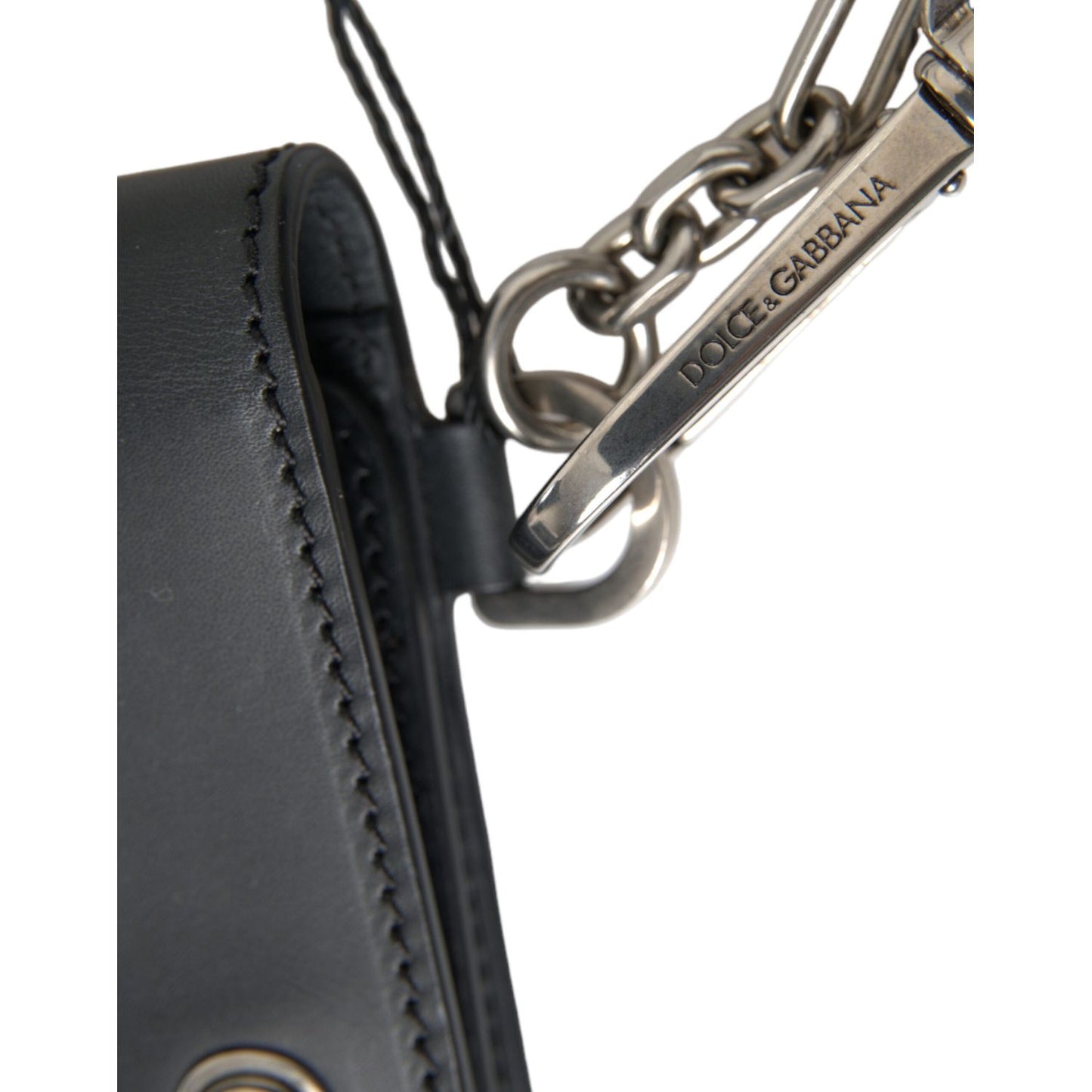 Close-up of Dolce & Gabbana Black Leather Logo Embossed Mini Bifold Wallet Borse Bag showing metal chain detail and logo.