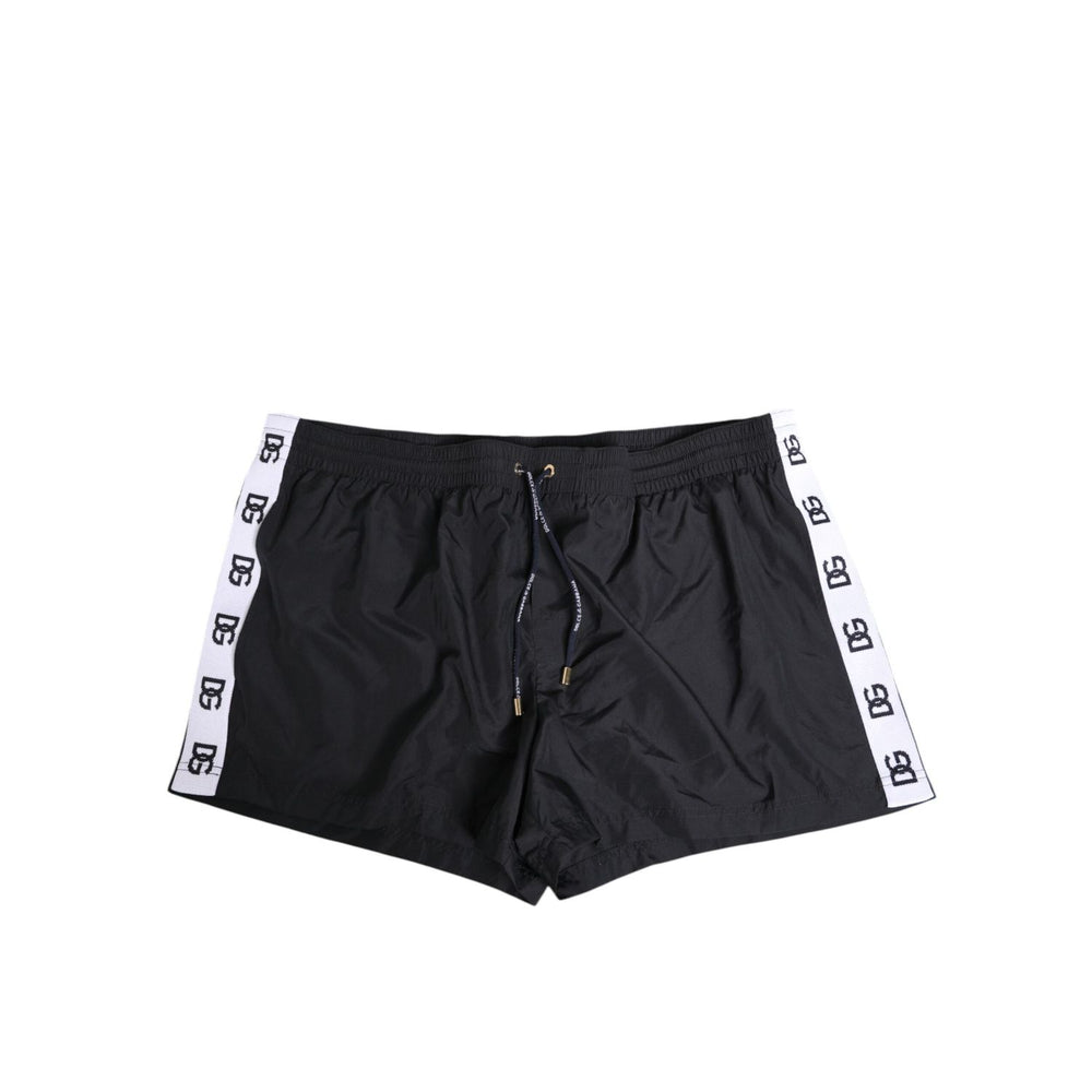 Dolce & Gabbana Black Nylon Side Logo Tape Shorts Swimwear with drawstring and logo details, featuring pockets for comfort and style.