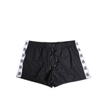 Dolce & Gabbana Black Nylon Side Logo Tape Shorts Swimwear with drawstring and logo details, featuring pockets for comfort and style.