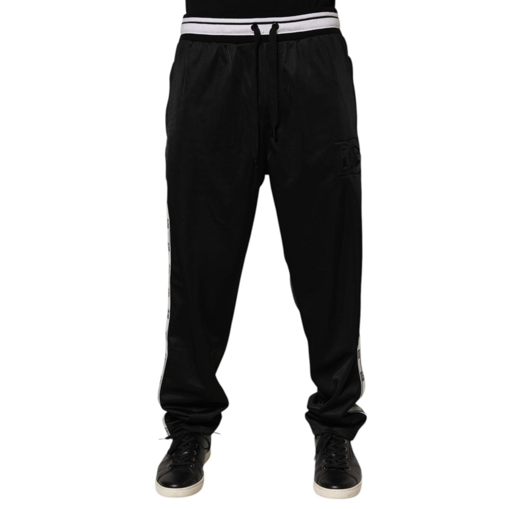 Dolce & Gabbana Black Polyester Logo Stripe Track Jogger Pants with drawstring waist and white logo stripes for stylish athleisure wear.