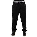 Dolce & Gabbana Black Polyester Logo Stripe Track Jogger Pants with drawstring waist and white logo stripes for stylish athleisure wear.