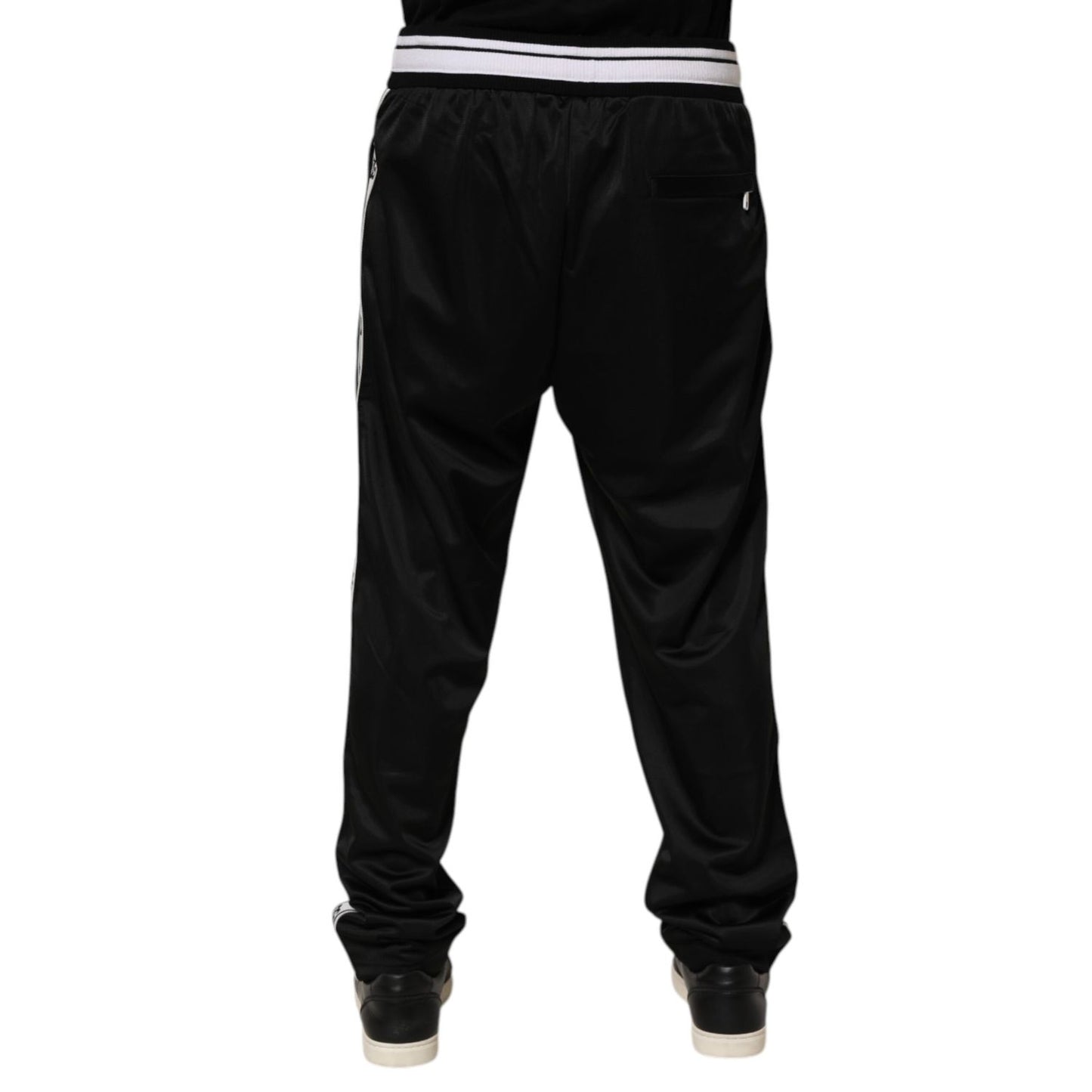Back view of Dolce & Gabbana Black Polyester Logo Stripe Track Jogger Pants with white waistband and sporty fit.