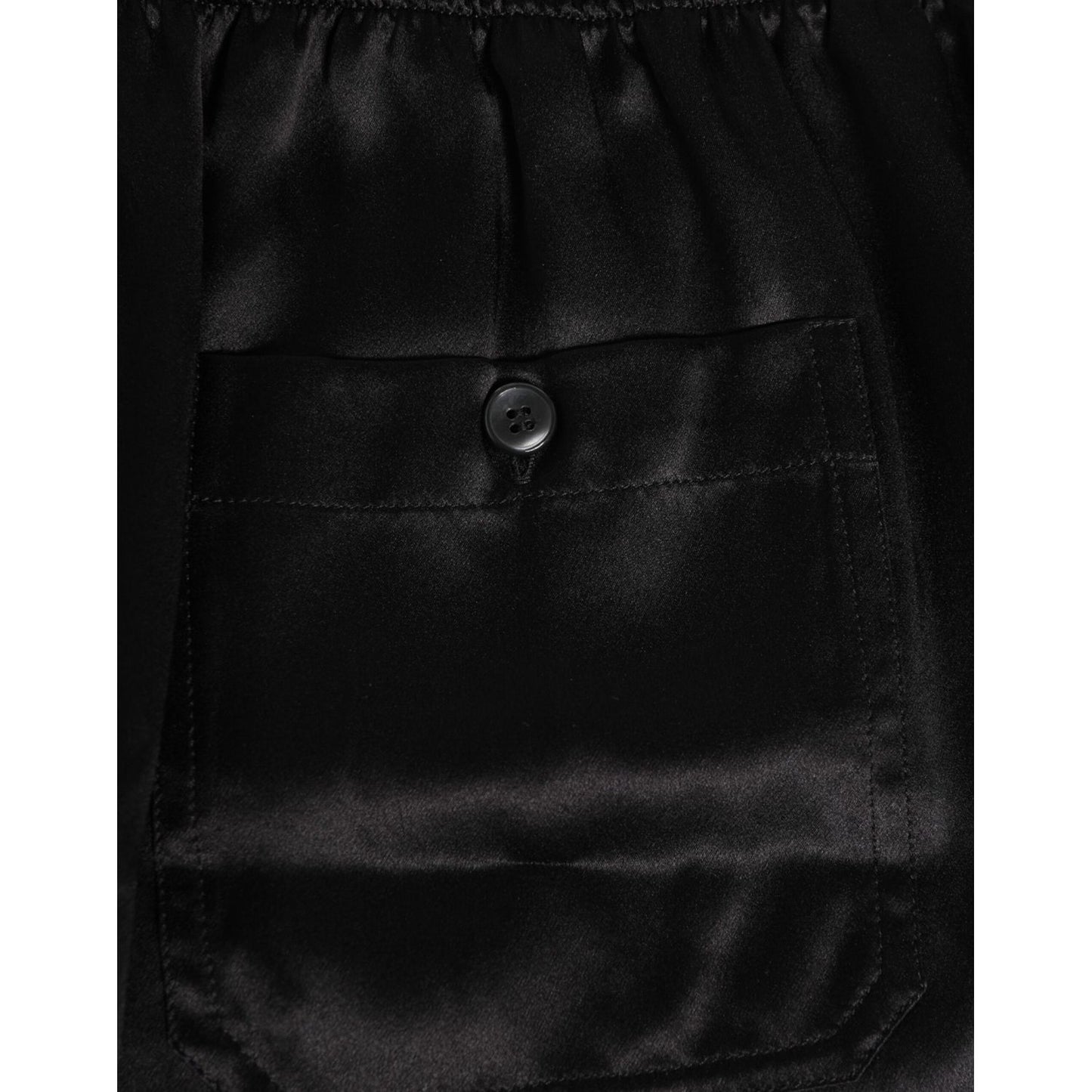 Dolce & Gabbana Black Silk Satin Elastic Men Boxer Short Swimwear with button detail and luxurious Italian craftsmanship.