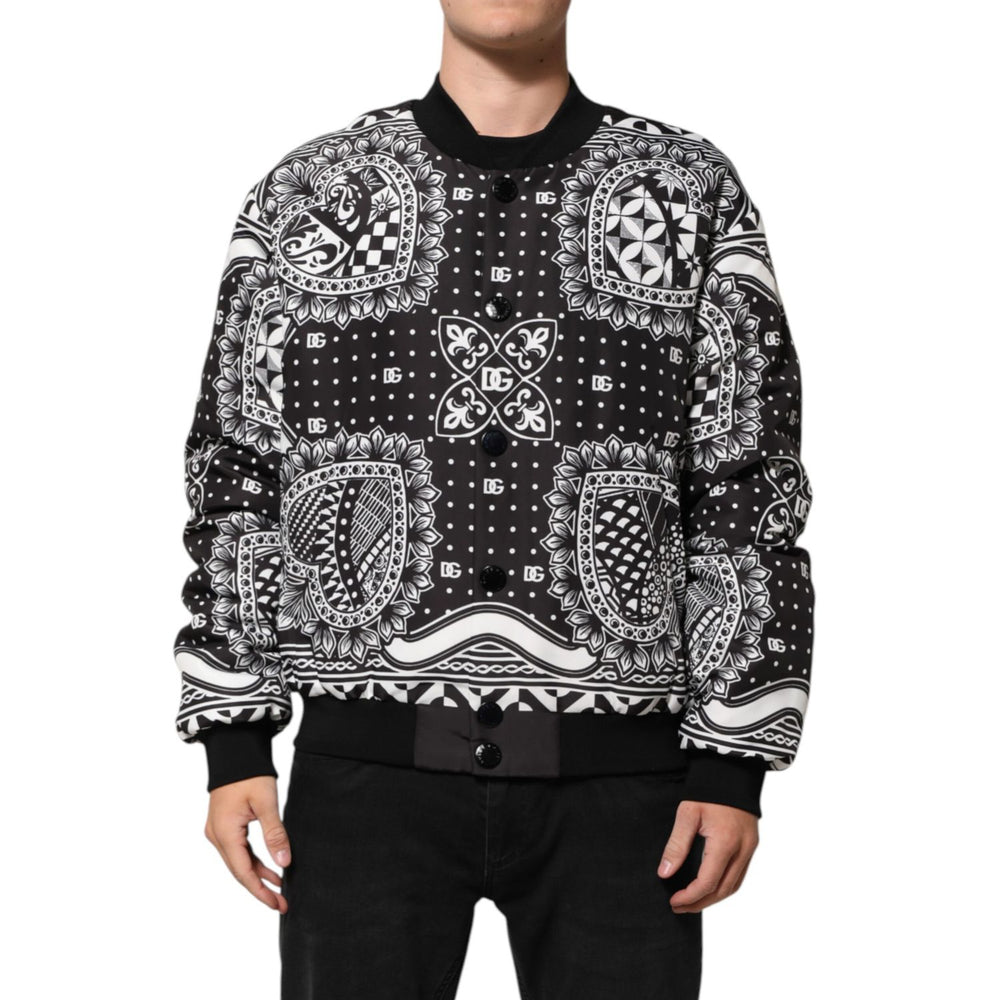 Dolce & Gabbana Black White Bandana Print Bomber Jacket with ribbed cuffs and button closure, modeled for a streetwear look.