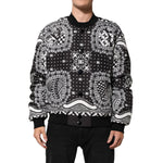 Dolce & Gabbana Black White Bandana Print Bomber Jacket with ribbed cuffs and button closure, modeled for a streetwear look.