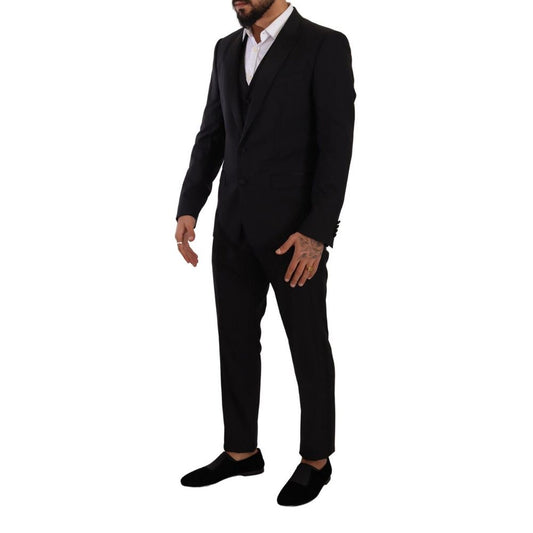 Model wearing Dolce & Gabbana Black Wool Suits & Blazer, slim fit, single-breasted with one button closure.
