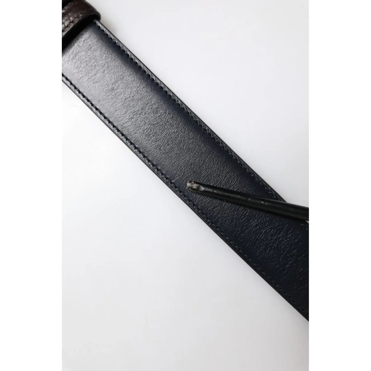 Close-up of Dolce & Gabbana Blue Brown Leather Buckle Reversible Belt showcasing high-quality leather and stitching details.