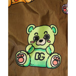 Dolce & Gabbana Brown Multicolor Teddy Bear Men Shorts Swimwear featuring a green teddy bear print, close-up of design details.